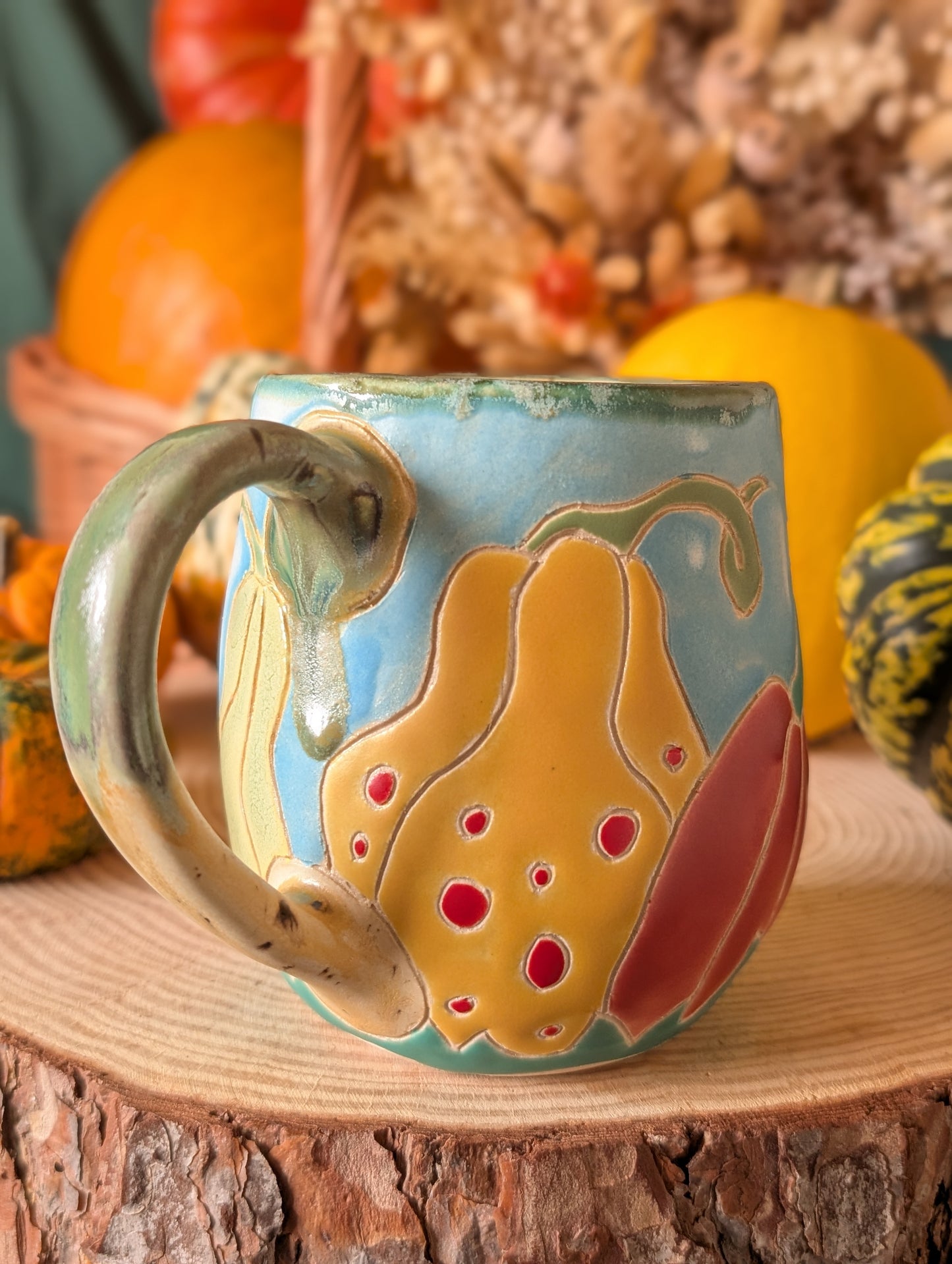Autumn-themed ceramic mugs featuring pumpkins and gourds with cottagecore design and cozy fall tones