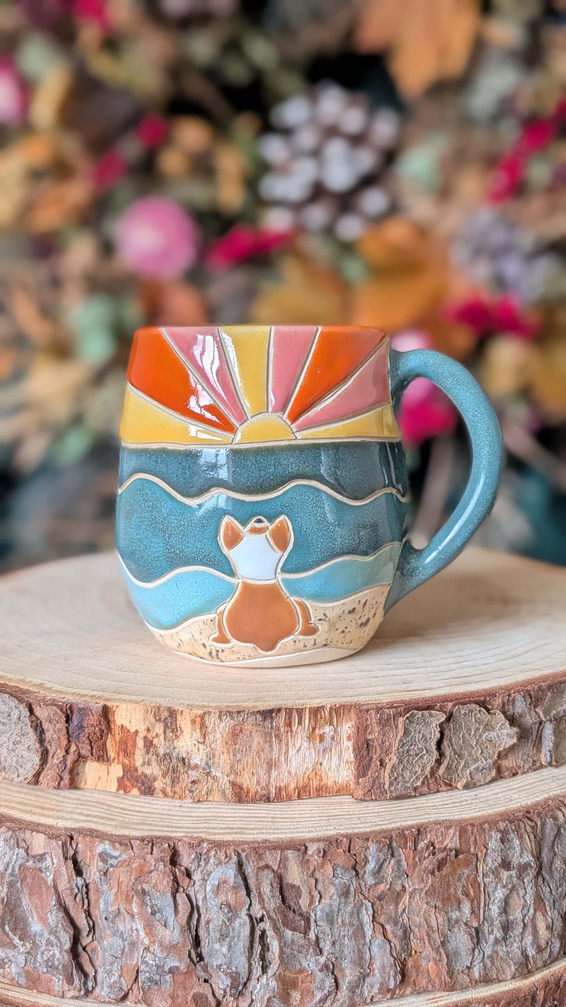 Handmade corgi mug with carved and hand-painted ceramic design, artisan pottery made in Yorkshire