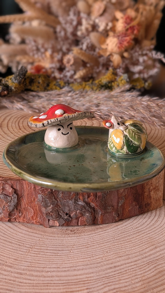Hedgehog and Mushroom Trinket Dish. Mushroom Biting a piece of amanita mushroom.
